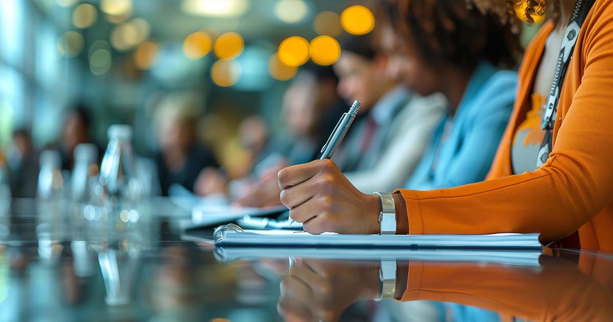 taking notes in a meeting